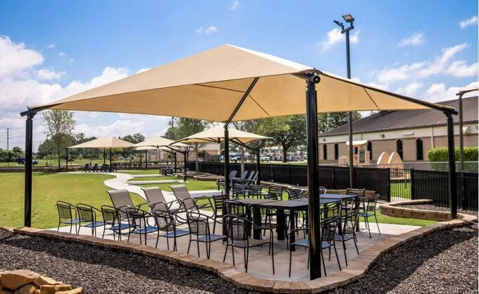 A square hip shade is a type of shade structure that features a square canopy with four sloping sides.